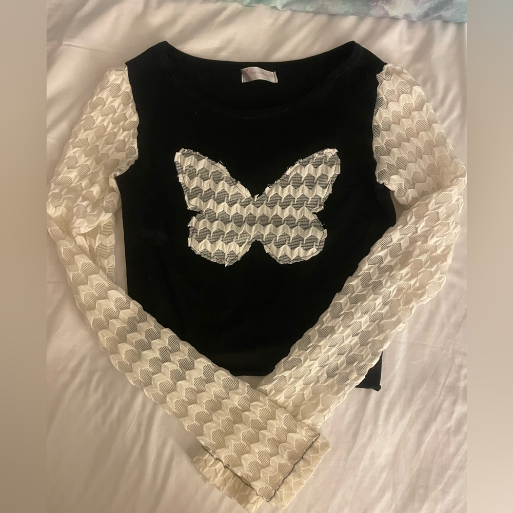 Custom made long sleeve top with a butterfly featuring a fun textured fabric.